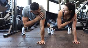 Toning Bingo Wings: Your Ultimate Guide to Sculpting Sleek Arms at the Gym 3 Fitness trainer demonstrating arm toning exercises Nottingham