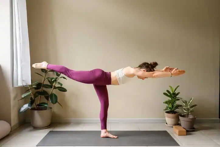 Achieving the Perfect Tone: How Often Should You Exercise for Results? 1 Woman doing Yoga exercise Nottingham to help with toning the body.